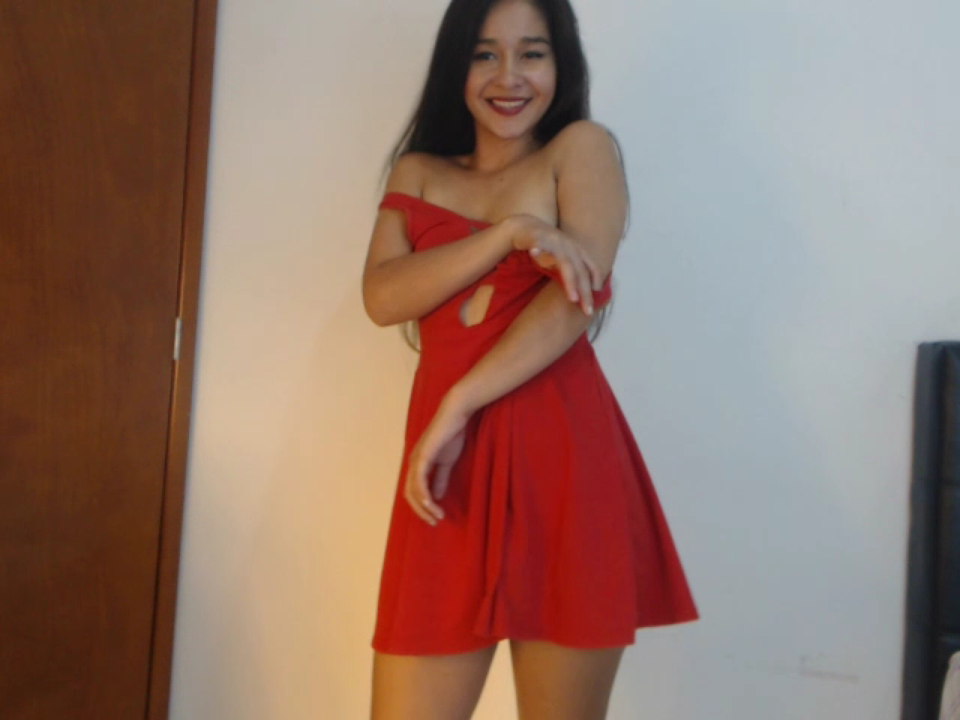 A sexy Latin girl in a red dress strips off showing her body, then squatting on the floor she pushes out some very small shit, with the help of her fingers. 6.5 minutes.